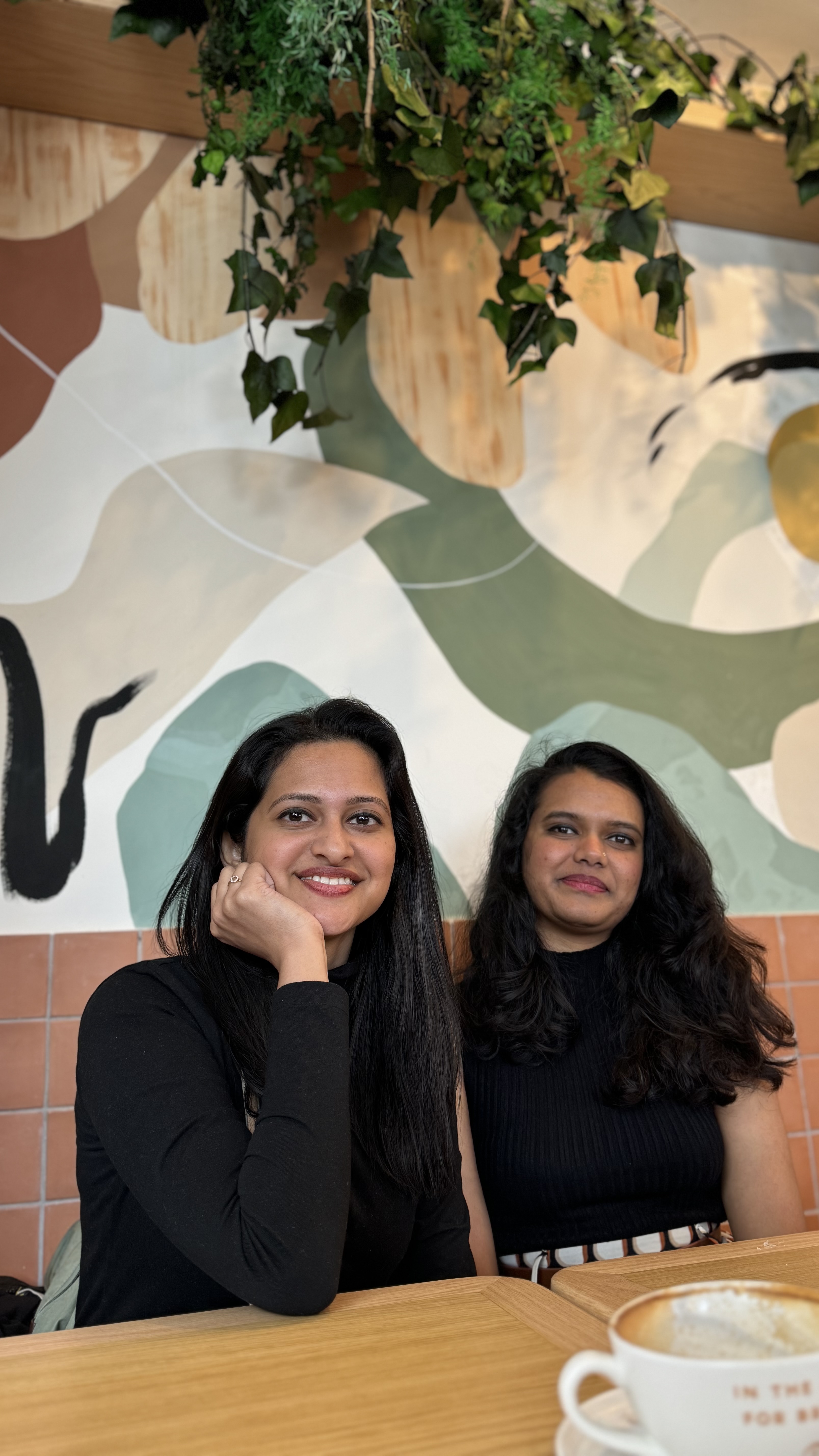 Mariyam and Amrita at the same morning café before heading out for the day